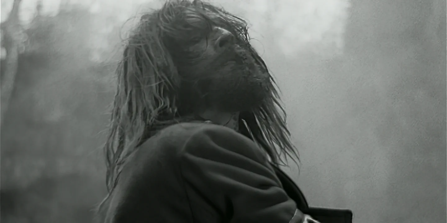 Close-up of clone in forest, wearing long officer's coat, looking menacing, Clone short film