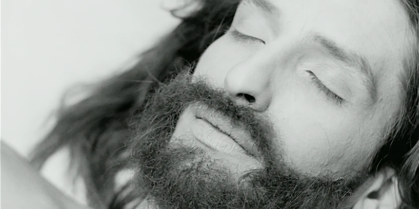 Close-up of clone with Christ-like white face, looking sleepy, Clone short film