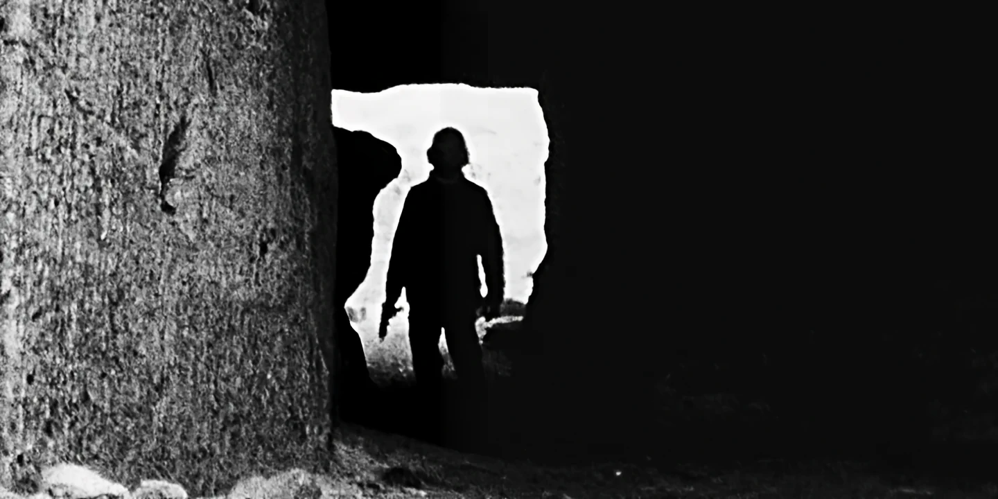 Dark tunnel with soldier in backlight holding machine gun, GAS short film