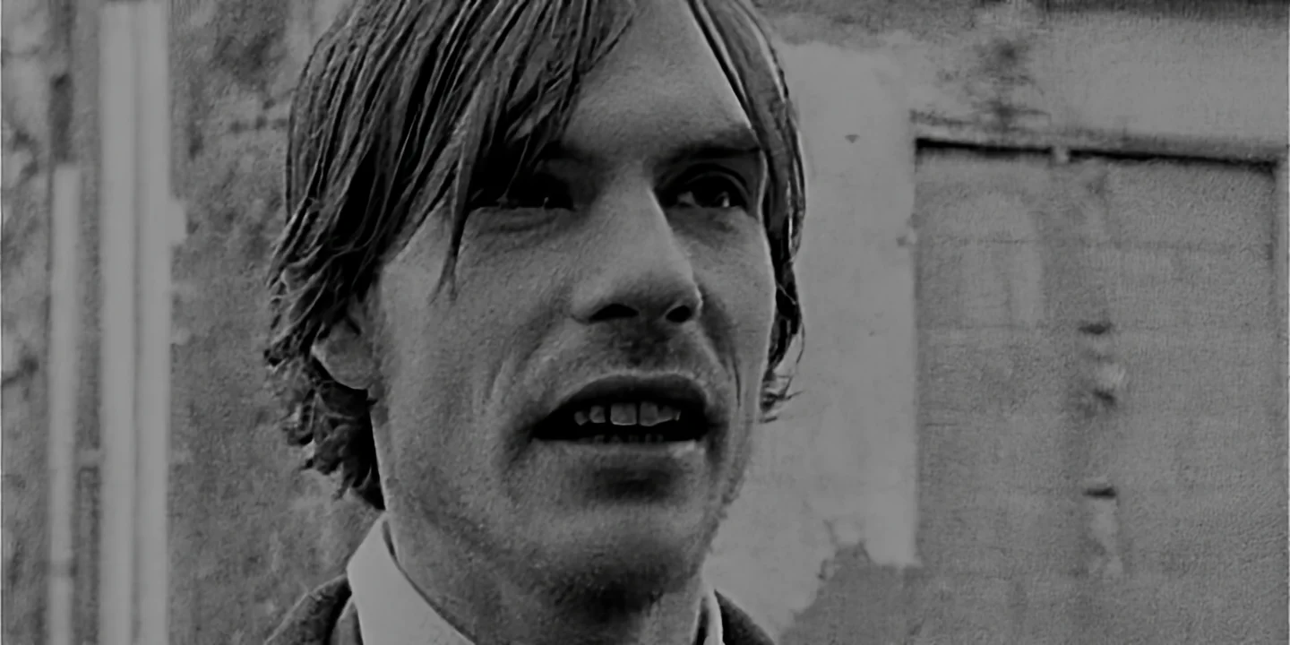 Close-up of happy future son-in-law facing future father-in-law, Eraserhead by David Lynch vibe, The Hand short film