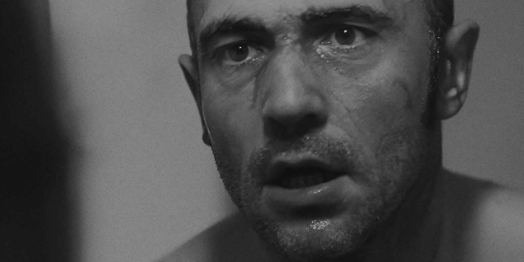 Man with haggard wet face, mix of water and blood, looking in mirror, Twice as Far