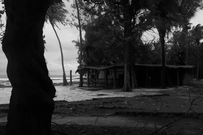 Black and white photo of a ghostly abandoned hotel on a deserted beach in Casamance, Senegal