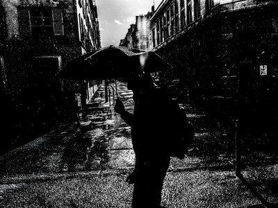 Red cushion washed ashore on the beach at Toubab Diallaw, Senegal